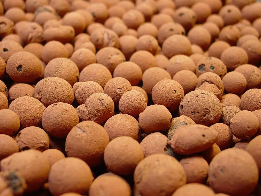 A pile of brown balls sitting on top of each other.